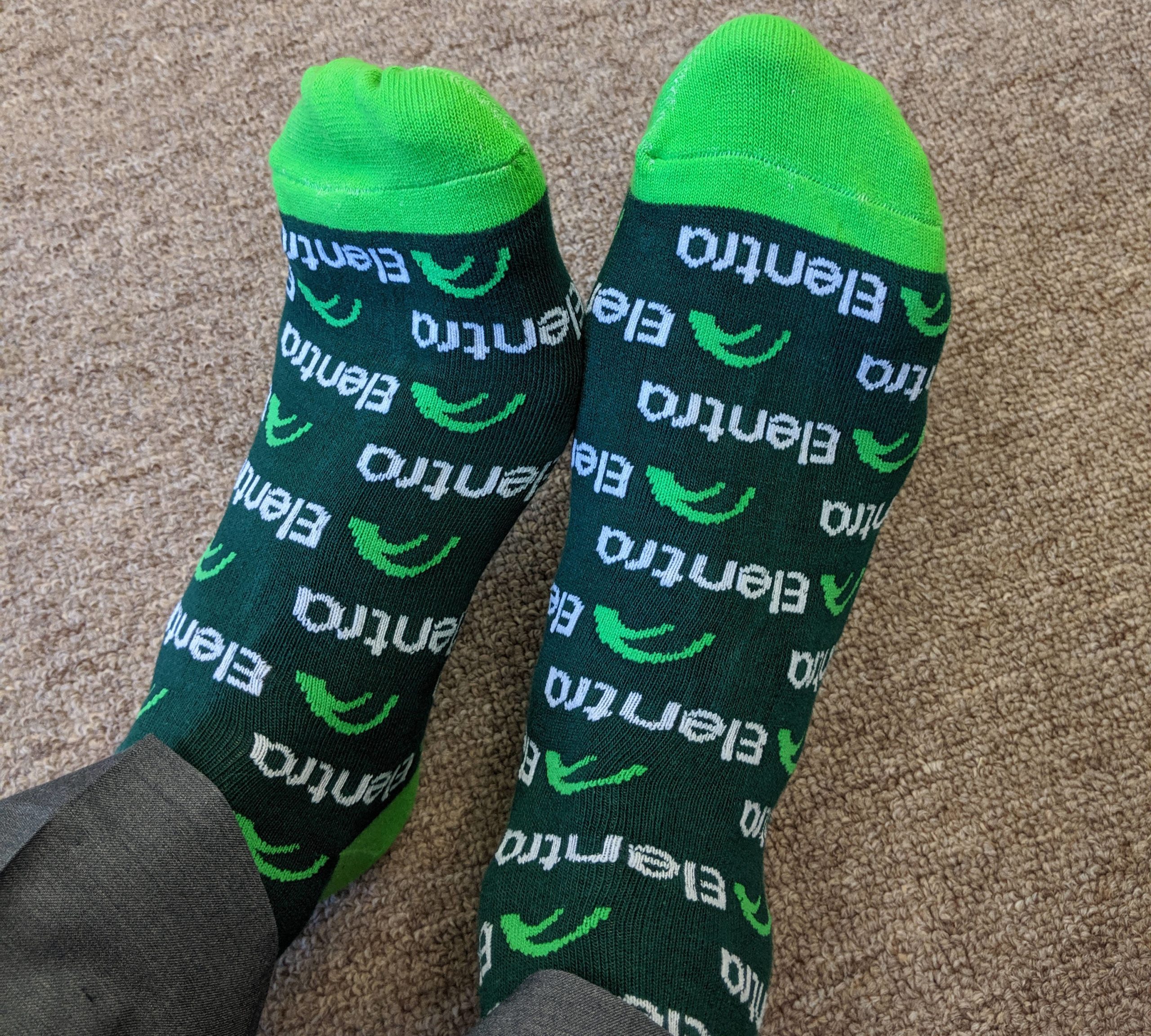 Consortium member’s feet wearing a pair of Elentra socks given away at an Elentra Engage conference.